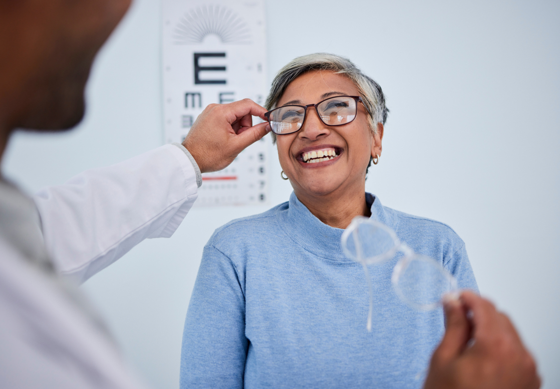 Woman getting new glasses at an eye doctor