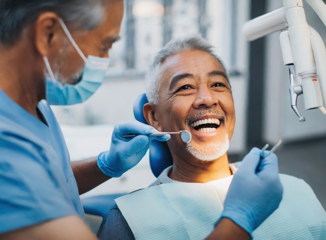 Older man at dentist smiling