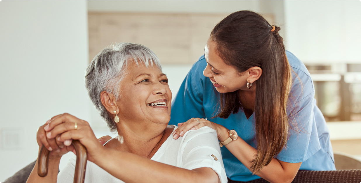 Health care provider with older woman with cane