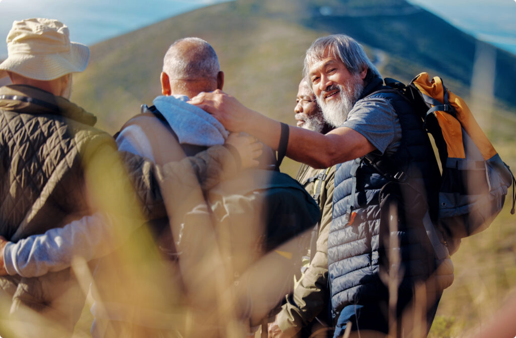 Happy men hiking with backpacks